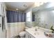 Well-appointed bathroom with a shower/tub combo, ample vanity space, and neutral color palette at 298 Bridges Farm Rd, Mooresville, NC 28115