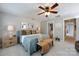 Comfortable bedroom with a ceiling fan, neutral colors, and ample space for relaxation and rest at 298 Bridges Farm Rd, Mooresville, NC 28115