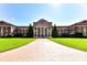 Classic red brick college building with manicured lawn and symmetrical design under a clear sky at 298 Bridges Farm Rd, Mooresville, NC 28115