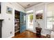 Inviting entryway with a storage closet, hardwood floors and an open view to the exterior porch at 298 Bridges Farm Rd, Mooresville, NC 28115