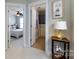 Inviting hallway leading to a bedroom and bathroom, showcasing the home's layout and design at 298 Bridges Farm Rd, Mooresville, NC 28115