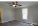 Bedroom featuring carpet flooring, a ceiling fan, and a bright window with natural light at 315 Second St, Stanley, NC 28164