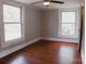 Bright bedroom featuring hardwood floors, classic trim, and abundant natural light at 315 Second St, Stanley, NC 28164
