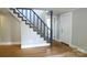 Entryway featuring hardwood floors, stairs leading upstairs, and an entrance to another room at 315 Second St, Stanley, NC 28164