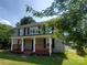 Charming two-story home with a welcoming front porch and well-maintained lawn at 315 Second St, Stanley, NC 28164