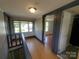 Upstairs hallway featuring hardwood floors, natural light, and access to other rooms at 315 Second St, Stanley, NC 28164