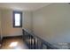 A naturally-lit hallway featuring hardwood floors and classic molding at 315 Second St, Stanley, NC 28164