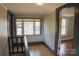 Hallway featuring hardwood floors, natural light from a window, and classic architectural details at 315 Second St, Stanley, NC 28164