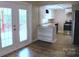 View of kitchen from doors leading to deck with granite countertops and stainless steel appliances at 315 Second St, Stanley, NC 28164