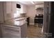 Updated kitchen with white cabinets, sleek appliances, and granite countertops at 315 Second St, Stanley, NC 28164