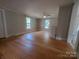 Bright living room with hardwood floors and two windows providing natural light at 315 Second St, Stanley, NC 28164