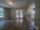 A bright living room with hardwood floors and access to the outside deck through double doors at 315 Second St, Stanley, NC 28164