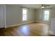 Main bedroom featuring hardwood floors and two windows providing natural light at 315 Second St, Stanley, NC 28164