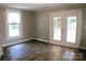 A sunlit room with access to a private outdoor patio from the double glass doors at 315 Second St, Stanley, NC 28164