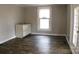 A sunlit room with white cabinets, and a view of the outdoors from a large window at 315 Second St, Stanley, NC 28164