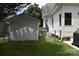View of a backyard featuring an outbuilding, a grill and an enclosed area for additional security at 318 N Laurel N St, Lincolnton, NC 28092