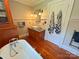Charming bathroom featuring a clawfoot tub, stylish vanity, and hardwood floors, exuding classic elegance at 318 N Laurel N St, Lincolnton, NC 28092