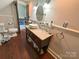 Well-lit bathroom with modern fixtures, a vessel sink, and wood floors at 318 N Laurel N St, Lincolnton, NC 28092
