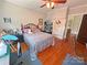 Cozy bedroom with hardwood floors, ceiling fan, and versatile decor, creating a comfortable and inviting atmosphere at 318 N Laurel N St, Lincolnton, NC 28092