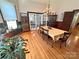 Spacious dining room with hardwood floors, chandelier, and glass doors leading to other rooms at 318 N Laurel N St, Lincolnton, NC 28092