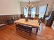 Traditional dining room with hardwood floors, chandelier, wood trim and large windows at 318 N Laurel N St, Lincolnton, NC 28092