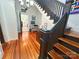 Beautiful foyer featuring hardwood floors, striking staircase and abundant natural light, showcasing the home's character at 318 N Laurel N St, Lincolnton, NC 28092