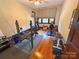Dedicated home gym with natural light, offering a convenient and private workout area with hardwood floors at 318 N Laurel N St, Lincolnton, NC 28092