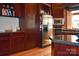 Modern kitchen featuring stainless steel appliances, dark wood cabinets and granite countertops at 318 N Laurel N St, Lincolnton, NC 28092