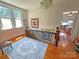 Cozy landing area with hardwood floors, large windows, and decorative quilts at 318 N Laurel N St, Lincolnton, NC 28092