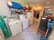 Functional laundry room with modern appliances, storage shelving, and ample counter space at 318 N Laurel N St, Lincolnton, NC 28092