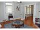 Cozy living room with hardwood floors, a ceiling fan, and ample natural light at 318 N Laurel N St, Lincolnton, NC 28092