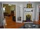 Well lit, open-concept living room with fireplace, hardwood floors and views into other rooms at 318 N Laurel N St, Lincolnton, NC 28092
