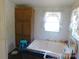 Bathroom featuring a soaking tub, cabinets, and a window with lace curtains at 33343 Old Salisbury Rd, Albemarle, NC 28001