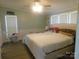 Comfortable bedroom with a large bed and plenty of natural light at 33343 Old Salisbury Rd, Albemarle, NC 28001