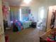 Comfortable bedroom with a closet, view to bathroom, and plenty of space in a home for sale at 33343 Old Salisbury Rd, Albemarle, NC 28001