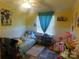 Cozy bedroom with light yellow walls, Bluey decor, and natural light from the window at 33343 Old Salisbury Rd, Albemarle, NC 28001