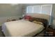 Bright bedroom with natural light, comfortable bedding, and calming decor for relaxation at 33343 Old Salisbury Rd, Albemarle, NC 28001