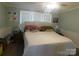 Bright bedroom with natural light, comfortable bedding, and calming decor for relaxation at 33343 Old Salisbury Rd, Albemarle, NC 28001