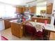 Functional kitchen with wooden cabinets, a large window, and updated appliances at 33343 Old Salisbury Rd, Albemarle, NC 28001