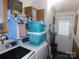 Functional laundry area features modern washer and dryer plus storage, offering convenience and efficiency at 33343 Old Salisbury Rd, Albemarle, NC 28001