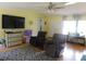 Comfortable living room with yellow walls, soft furniture, and a welcoming atmosphere at 33343 Old Salisbury Rd, Albemarle, NC 28001