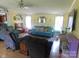 Inviting living room with comfortable blue sofas, cozy chairs, and a bright, airy atmosphere at 33343 Old Salisbury Rd, Albemarle, NC 28001