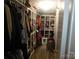Spacious walk-in closet featuring built-in shelving, ample storage, and well-organized compartments at 33343 Old Salisbury Rd, Albemarle, NC 28001