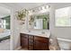 Bright bathroom boasts a double vanity, modern fixtures, and a decorative mirror at 389 Whispering Hills Dr, Locust, NC 28097
