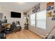 Cozy bedroom with hardwood floors, natural light, and ample space for a home office at 389 Whispering Hills Dr, Locust, NC 28097