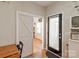 Inviting entryway with a sliding barn door and coat storage at 389 Whispering Hills Dr, Locust, NC 28097