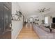 Spacious living room features an open floor plan, hardwood floors, and a ceiling fan at 389 Whispering Hills Dr, Locust, NC 28097