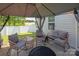 Outdoor patio featuring comfortable seating and a shaded gazebo, perfect for entertaining at 389 Whispering Hills Dr, Locust, NC 28097