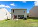 Backyard with patio, green grass, perfect for outdoor entertaining and relaxation at 4732 Gibbons Link Rd, Charlotte, NC 28269