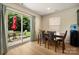 Bright dining room with sliding glass doors to the patio, perfect for indoor-outdoor living at 4732 Gibbons Link Rd, Charlotte, NC 28269